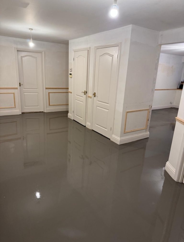 Wood effect flooring in a spacious modern room