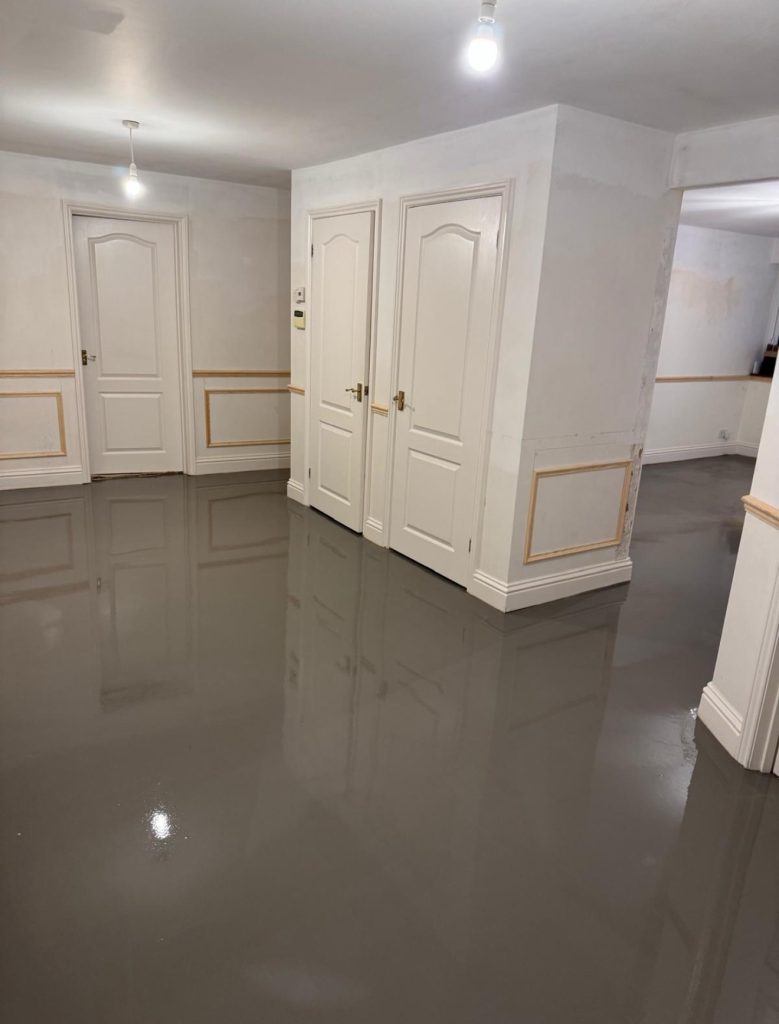 Wood effect flooring in a spacious modern room